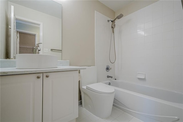 full bathroom featuring vanity, toilet, tile patterned floors, and tiled shower / bath