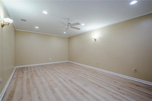 empty room with crown molding, ceiling fan, and light hardwood / wood-style flooring