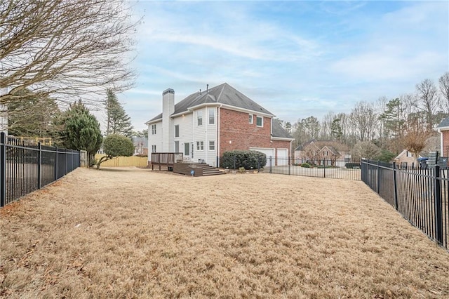 view of side of property with a garage and a yard