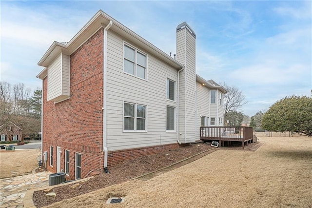 back of property featuring a deck