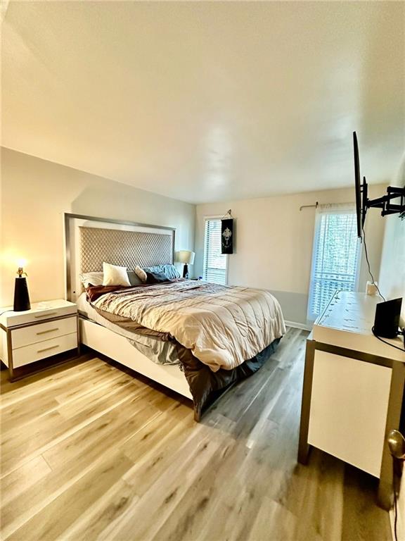 bedroom with hardwood / wood-style floors