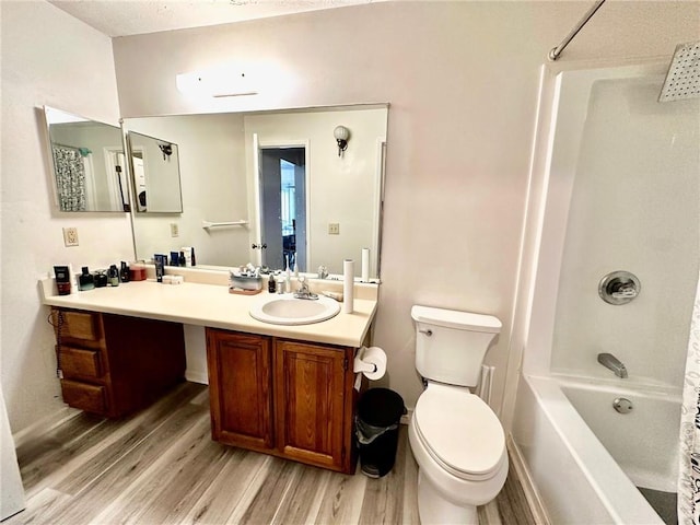 full bathroom featuring shower / tub combo, vanity, hardwood / wood-style flooring, and toilet