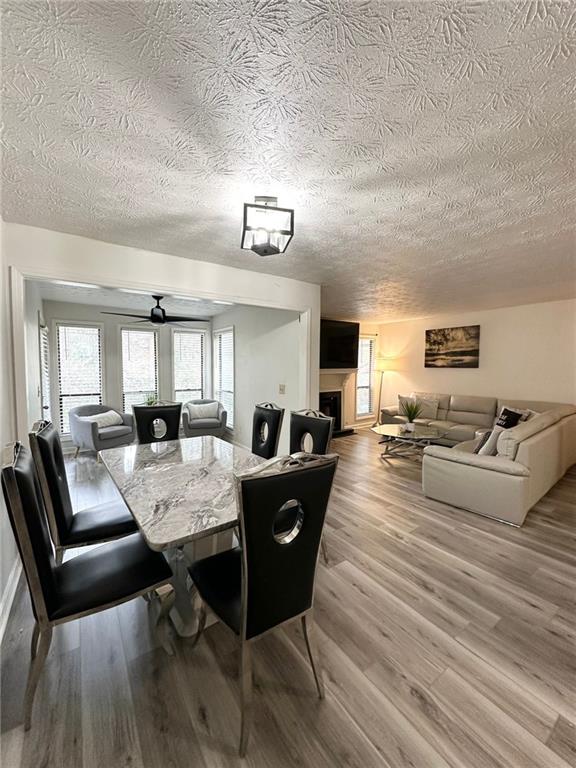 dining space featuring hardwood / wood-style flooring and ceiling fan