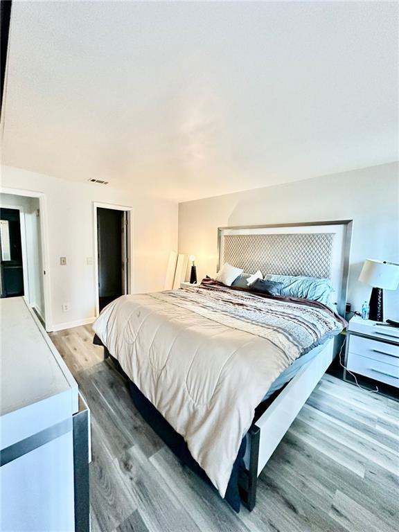 bedroom featuring hardwood / wood-style floors