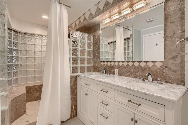 bathroom featuring tile walls, vanity, and decorative backsplash