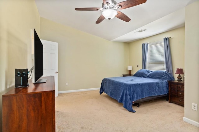 bedroom featuring light carpet, baseboards, and ceiling fan
