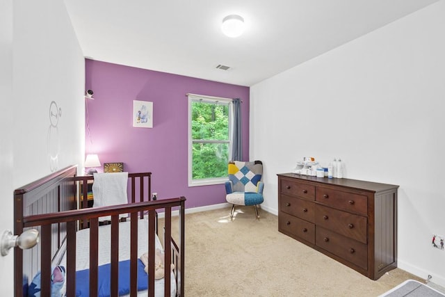 bedroom featuring carpet and baseboards