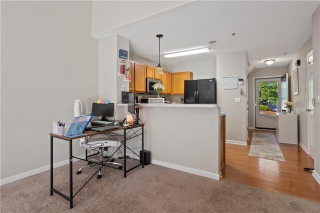 210 Cottonwood Creek Cir, Canton, GA 30114 - kitchen with black refrigerator with ice dispenser, stainless steel microwave, light colored carpet, a peninsula, and an office area