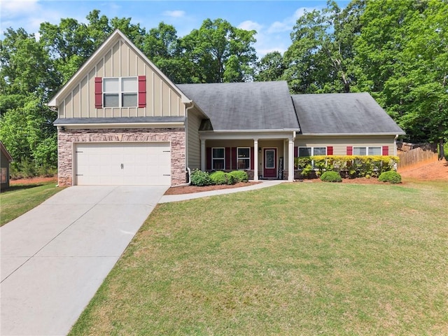 craftsman-style home with an attached garage, board and batten siding, concrete driveway, and a front yard
