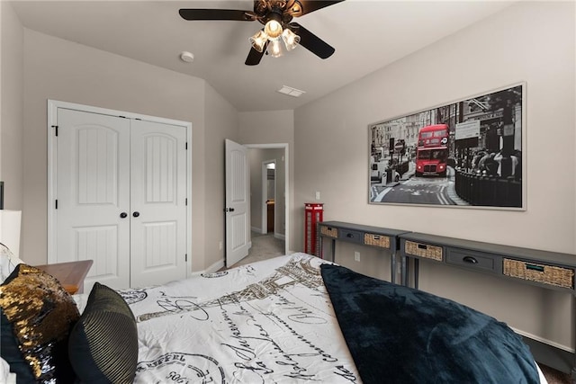 carpeted bedroom featuring a closet, baseboards, ceiling fan, and visible vents