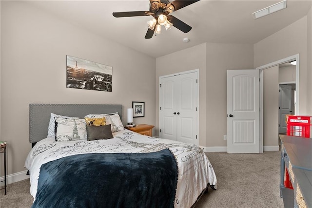 bedroom featuring carpet floors, visible vents, a closet, baseboards, and a ceiling fan