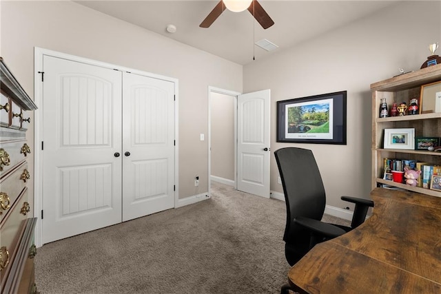 carpeted home office featuring ceiling fan and baseboards