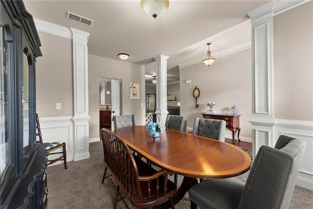 dining space with visible vents, carpet, and decorative columns
