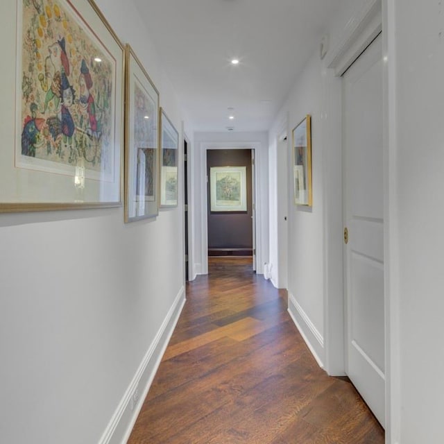 corridor featuring dark hardwood / wood-style flooring