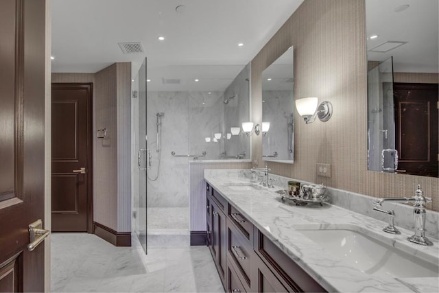 bathroom featuring vanity and a tile shower