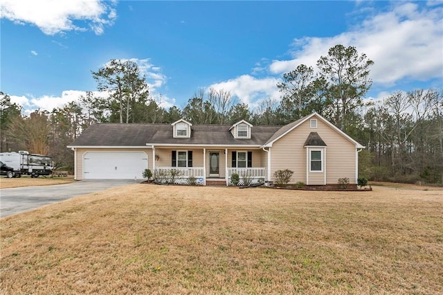 view of front of property with covered porch, driveway, a front lawn, and an attached garage