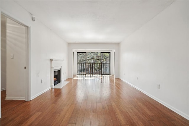 unfurnished living room featuring wood-type flooring