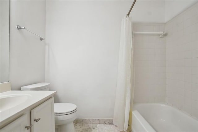 full bathroom featuring vanity, shower / bath combo, and toilet