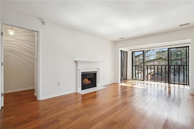 unfurnished living room featuring hardwood / wood-style floors