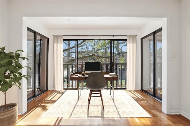 office space with light hardwood / wood-style floors