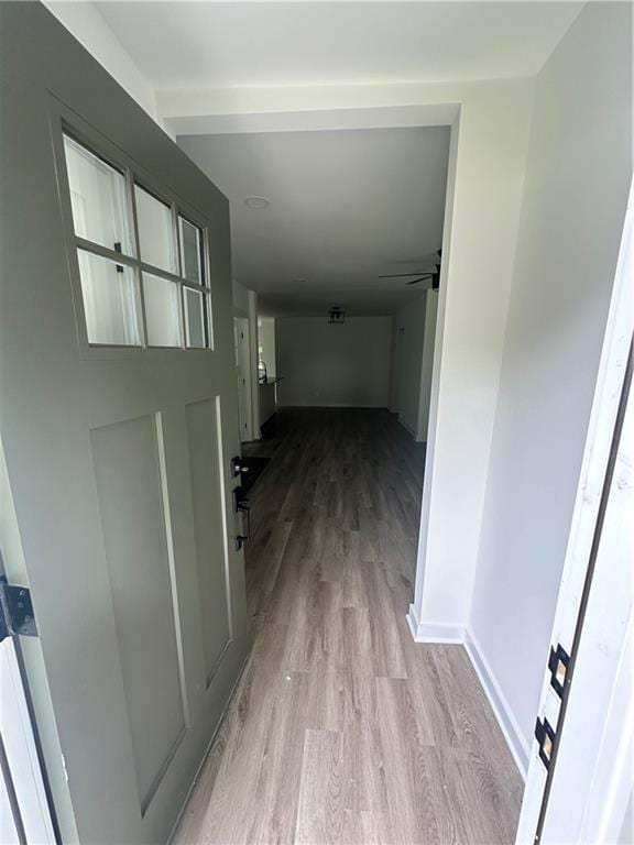 hall with light hardwood / wood-style flooring