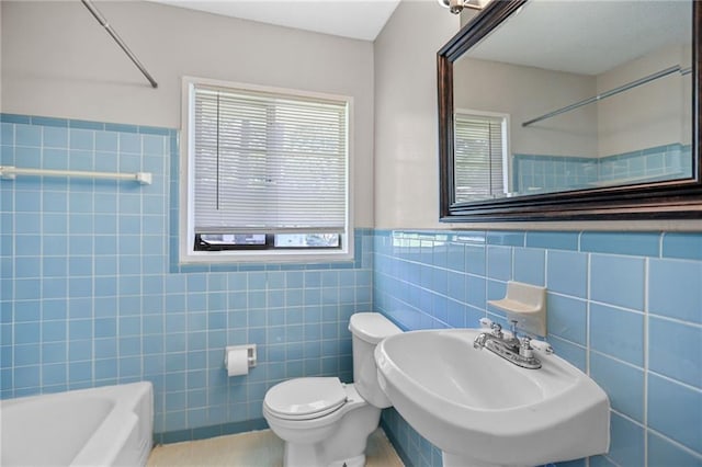 2215 Springdale Rd SW, Atlanta, GA 30315 - full bath with tile walls, a sink, toilet, wainscoting, and tile patterned floors