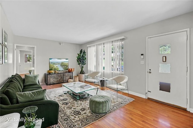 2215 Springdale Rd SW, Atlanta, GA 30315 - living room with plenty of natural light, light wood finished floors, and baseboards