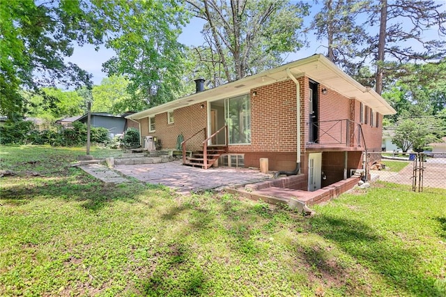 2215 Springdale Rd SW, Atlanta, GA 30315 - rear view of house with a patio area, brick siding, and a gate