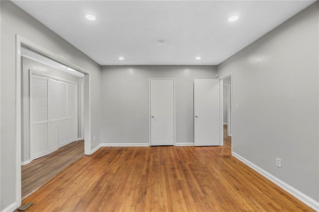 2215 Springdale Rd SW, Atlanta, GA 30315 - unfurnished bedroom with baseboards, wood finished floors, and recessed lighting