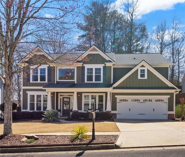 craftsman-style home featuring board and batten siding, concrete driveway, and a garage