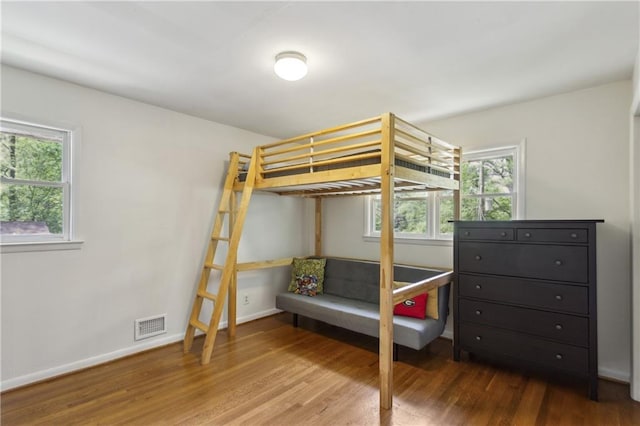 205 Glencourtney Dr, Sandy Springs, GA 30328 - bedroom with wood finished floors, multiple windows, and baseboards
