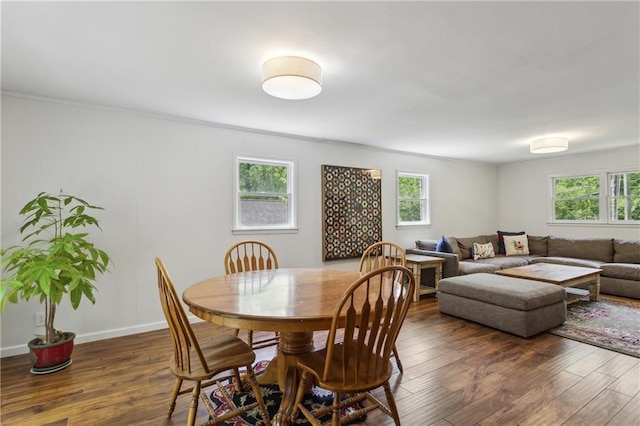 205 Glencourtney Dr, Sandy Springs, GA 30328 - dining space with healthy amount of natural light, wood finished floors, ornamental molding, and baseboards