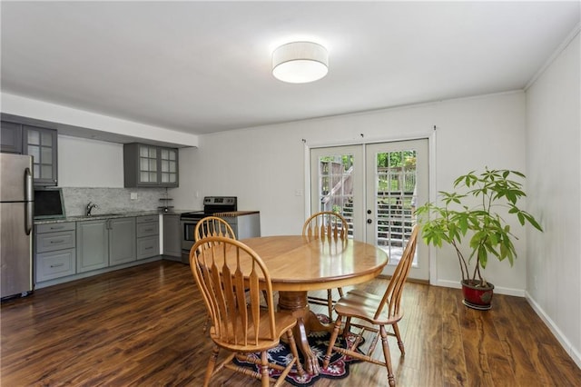 205 Glencourtney Dr, Sandy Springs, GA 30328 - dining area with french doors, dark wood-type flooring, and baseboards