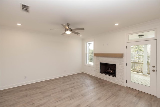 708 Dodd Ln Unit 156, Buford, GA 30518 - unfurnished living room featuring ceiling fan, a wealth of natural light, ornamental molding, and visible vents