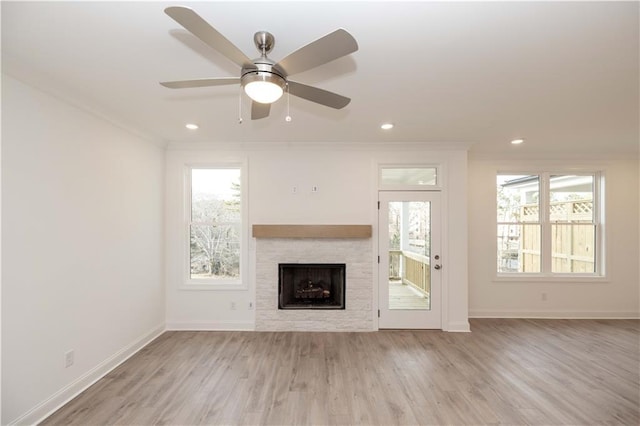 708 Dodd Ln Unit 156, Buford, GA 30518 - unfurnished living room with light wood-style flooring, recessed lighting, a ceiling fan, crown molding, and a fireplace