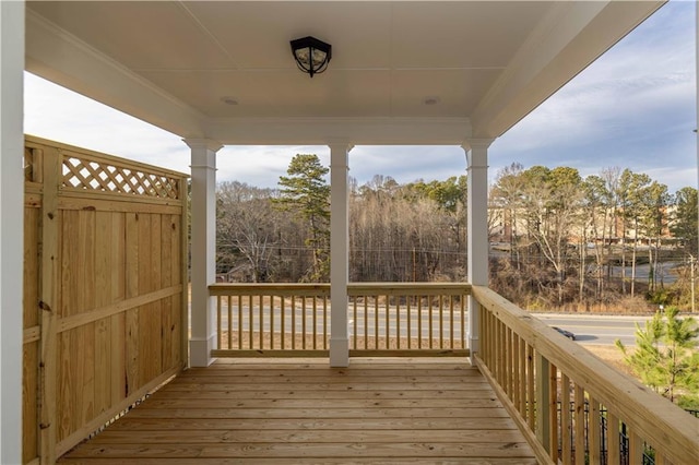 708 Dodd Ln Unit 156, Buford, GA 30518 - unfurnished living room featuring a stone fireplace, baseboards, ornamental molding, and plenty of natural light