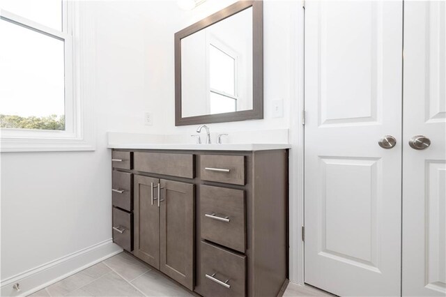 708 Dodd Ln Unit 156, Buford, GA 30518 - bathroom with baseboards, vanity, marble finish floor, and a shower stall