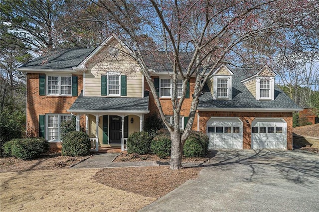 front of property with a garage