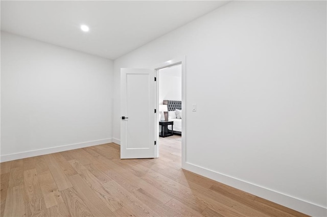 unfurnished room with light hardwood / wood-style floors