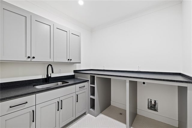 laundry room with sink and ornamental molding