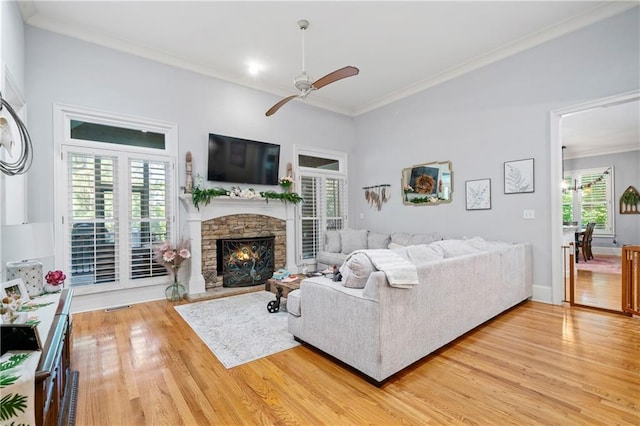11 York Trce, Cartersville, GA 30121 - living room featuring a ceiling fan, ornamental molding, light wood-style floors, baseboards, and a fireplace