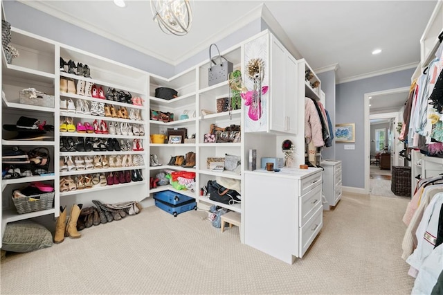 11 York Trce, Cartersville, GA 30121 - walk in closet with light colored carpet and a chandelier