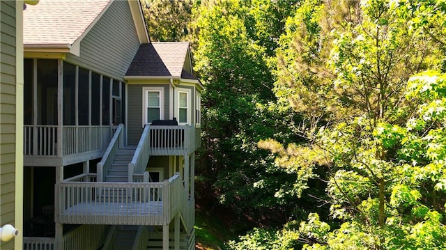 11 York Trce, Cartersville, GA 30121 - view of home's exterior featuring stairs, a sunroom, roof with shingles, and a deck