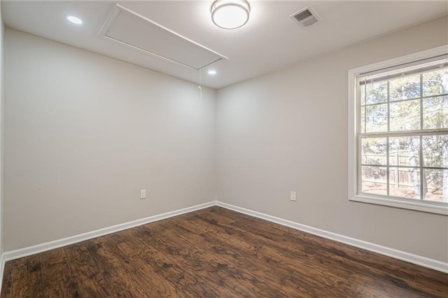 spare room with dark hardwood / wood-style floors