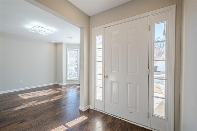 foyer entrance with dark wood-type flooring