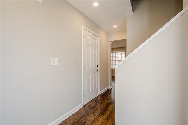 hallway with dark wood-type flooring