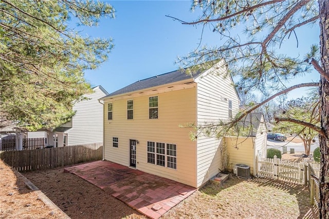 back of house featuring central air condition unit and a patio area