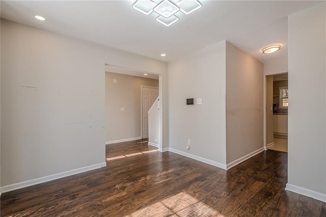 empty room featuring dark hardwood / wood-style flooring