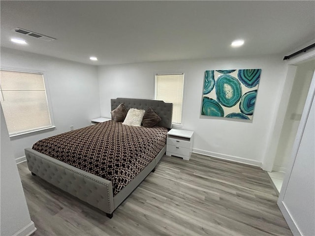 bedroom featuring wood-type flooring