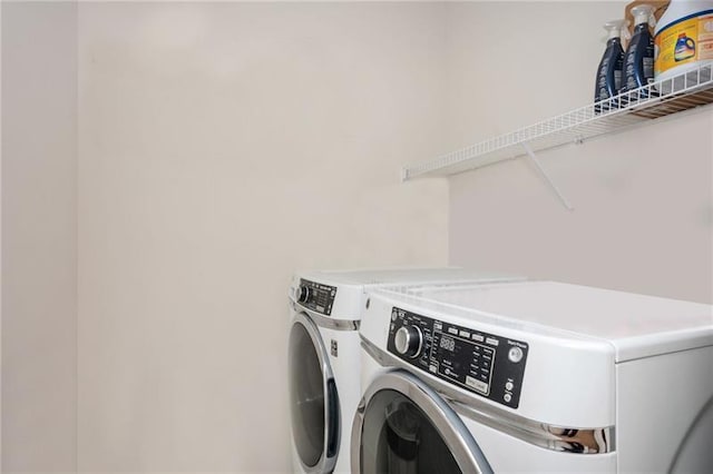 laundry area with washing machine and dryer and laundry area